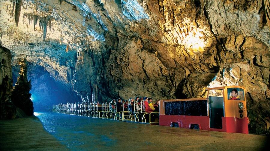 From Trieste: Postojna Cave & Predjama Castle - Entering Postojna Cave by electric train