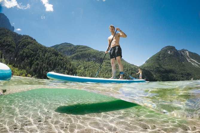 Half Day Stand-up Paddle Boarding (SUP) trip on Lake Predil - Getting your balance on a RED paddleboard