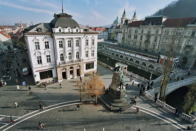 Private city tour of Ljubljana. 4 hours with a friendly and fun local guide. - Market stalls, Dragon Bridge, and city symbols