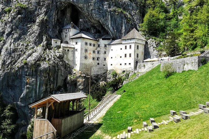 Slovenian highlights - Lake Bled, Postojna Cave & Predjama Castle from Ljubljana - Lake Bled: lake views, castle walls, and a wooden boat